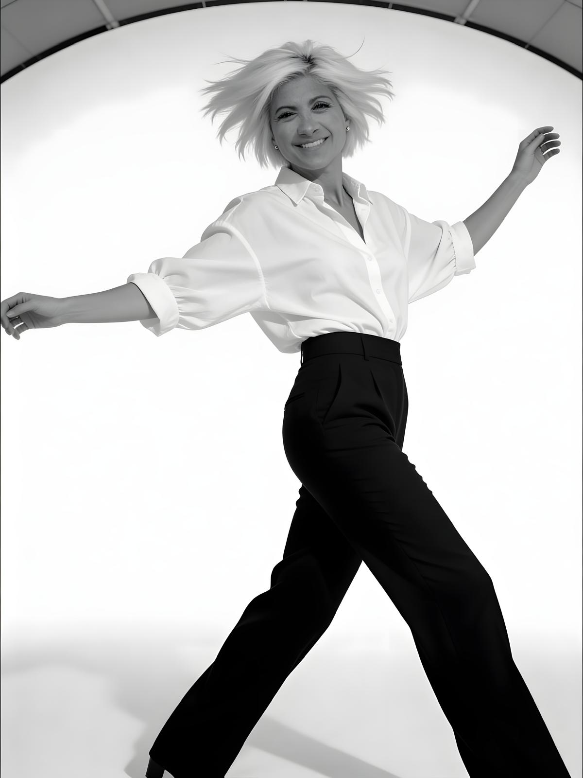 Joanna Maragos mid-motion in a black and white studio shot